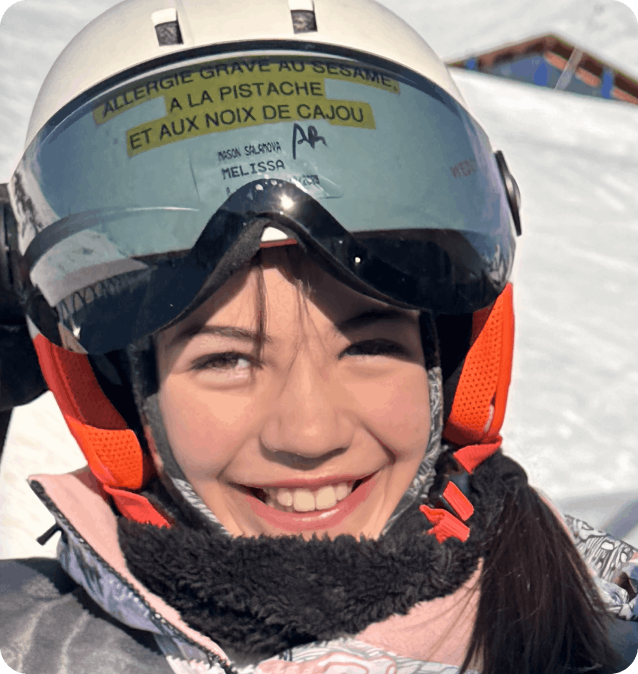 Warning sticker on Melissa’s helmet at ski lunch in France